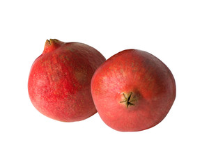 two fresh pomegranates on a white background