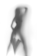 Perfect shape dancer woman with umbrella, silhouette