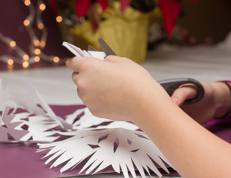 Cutting Paper Snowflakes