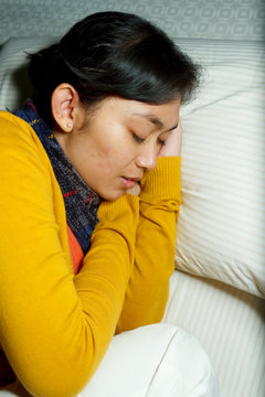 Ill young woman sleep on bed