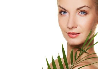 Fototapeta premium Beautiful woman with green plant