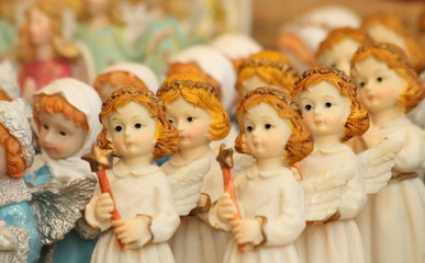 christmas angelic figurine with Bethlehem star in hand