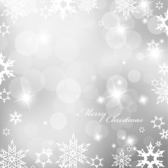 Christmas silver background with snow flakes.