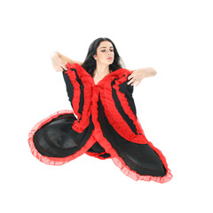 studio portrait of young beautiful woman dancing flamenco over w