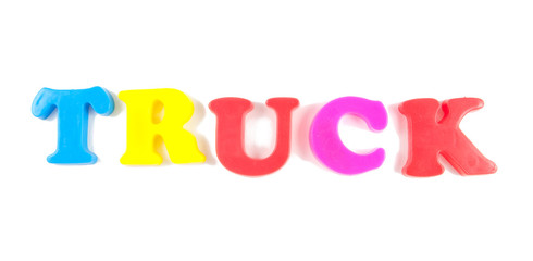 truck written in fridge magnets isolated on white