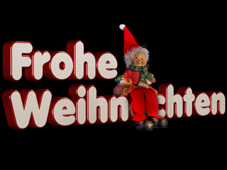 Weihnachtszwerg sitzend auf Schrift Frohe Weihnachten