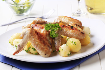 Roasted chicken wings and potatoes