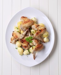 Roasted chicken wings and potatoes