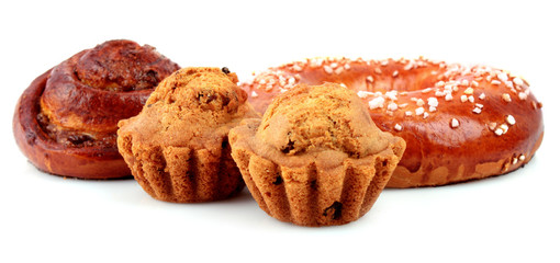Loaf with raisins and muffin isolated on white