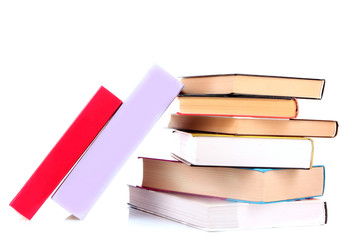 Hard cover books and green apple isolated on white