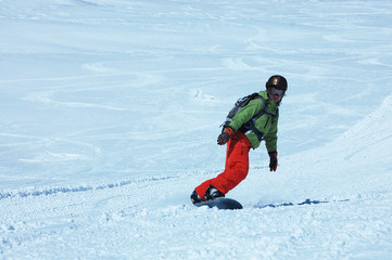 Fototapeta na wymiar Young lady snowboarder