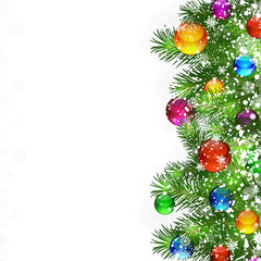 Christmas background with decorated branches of Christmas tree.