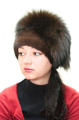 Woman in fur hat isolated on white background