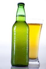 Green bottle of beer and glass