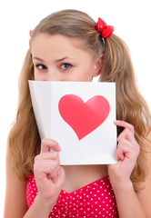 attractive teenage girl embarrassingly hides her smile behind a