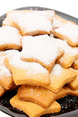 Asterisk cookies on a plate.