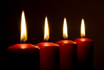 Fototapeta na wymiar Four red candles