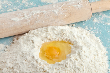 Broken egg on flour, means for making bread