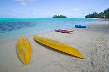 Empty Kayaks on a Tropical Beach