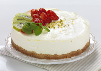 a fruit decorated cheese  cake