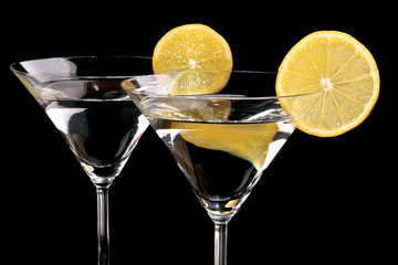 Martini glasses on black background