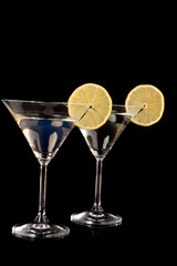 Martini glasses on black background