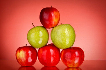 Apples on red background