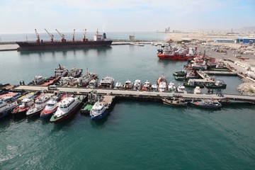 many cutters at its mooring in port. People on their cutters