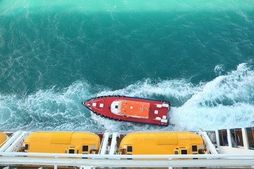 motor boat near cruise ship. view from deck of cruise ship.
