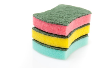 A stack of cleaning sponges on a white background