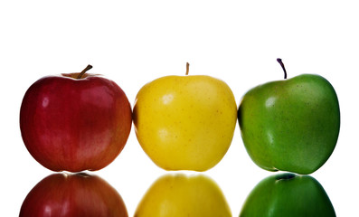 Three apples are located in the form of a traffic light