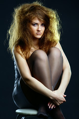 Naklejka premium Portrait of the beautiful girl with a mad hairdress
