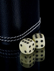 Two dice on black