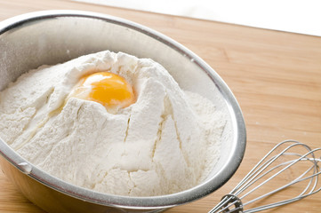 White flour and egg  in bowl
