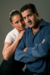 Young couple, man and woman, studio shot