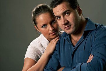 Young couple, man and woman, studio shot