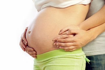 Pregnant woman, close-up of hands of a man and woman