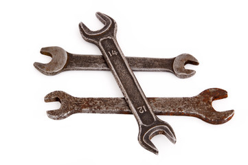 Old rusty wrench, isolated on white background