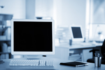 Computer and notebook on the working place in the office