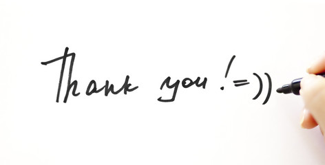 Writing "Thank you!" with smile on the white
