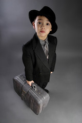 The boy in a suit of traveler