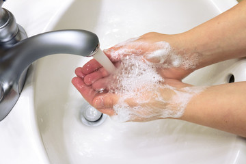 Fototapeta premium washing hands with soap