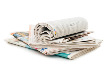 Roll of newspapers, isolated on white background