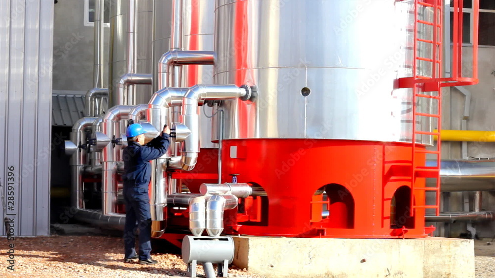 Wall mural Man working in a power plant