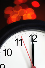 Office clock about to show midnight - few seconds to New Year