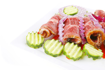 served beef rolls on white
