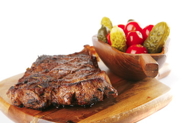 grilled meat on wooden plate