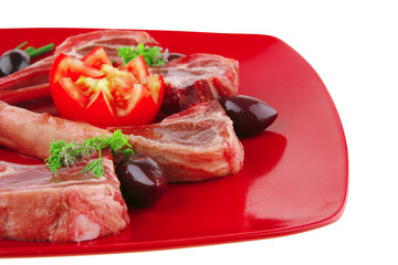 image of ribs served on red