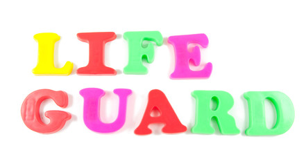 life guard written in fridge magnets on white background