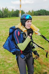 The smiling girl-parachutist